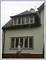 window cleaning on house in heald green